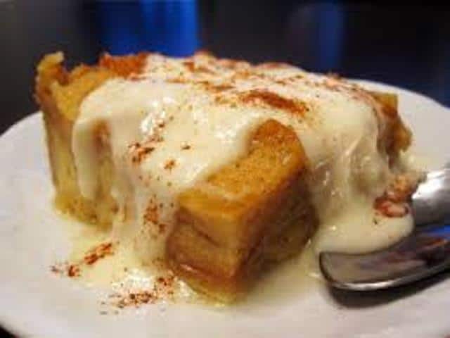 Bread Pudding with Hazelnut Liquor Sauce and Spiced Whipped Cream